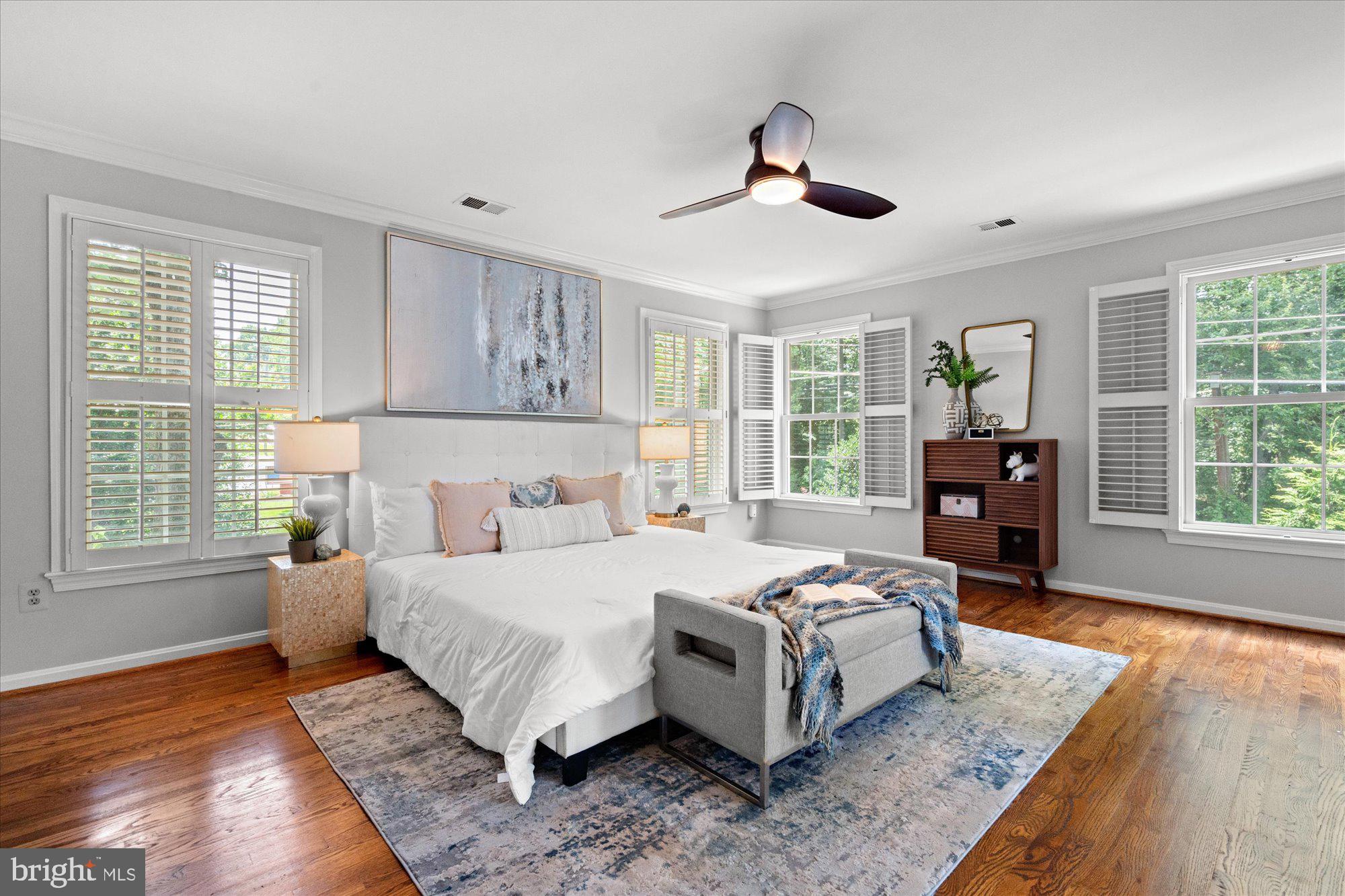 7287 Evans Mill Road McLean, VA 22101 - Photo 16 of 30 a bedroom with a bed and wooden floor