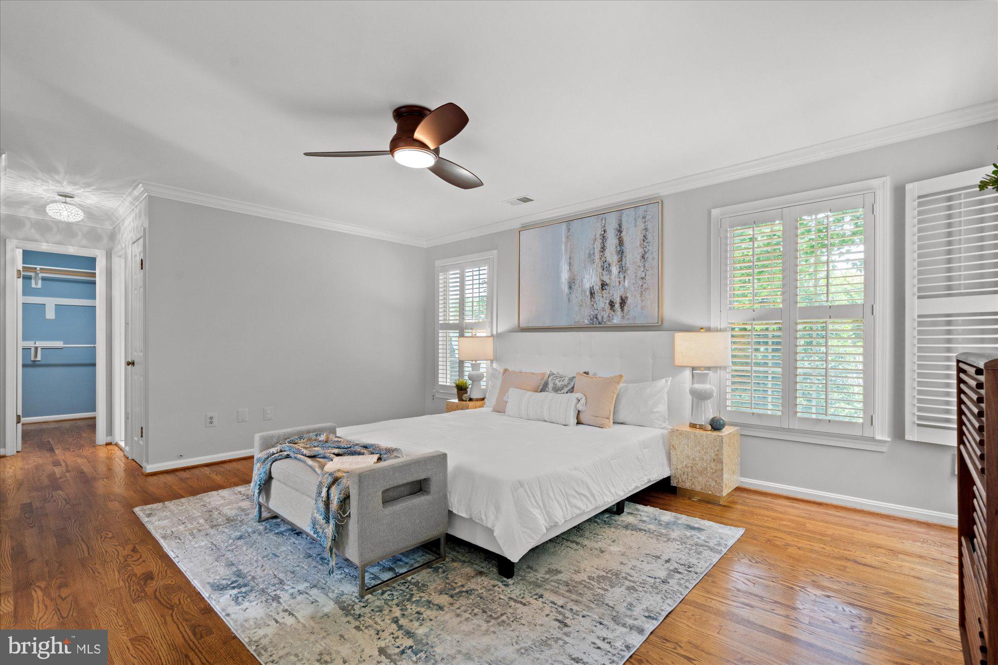 7287 Evans Mill Road McLean, VA 22101 - Photo 17 of 30 a bedroom with a bed and wooden floor