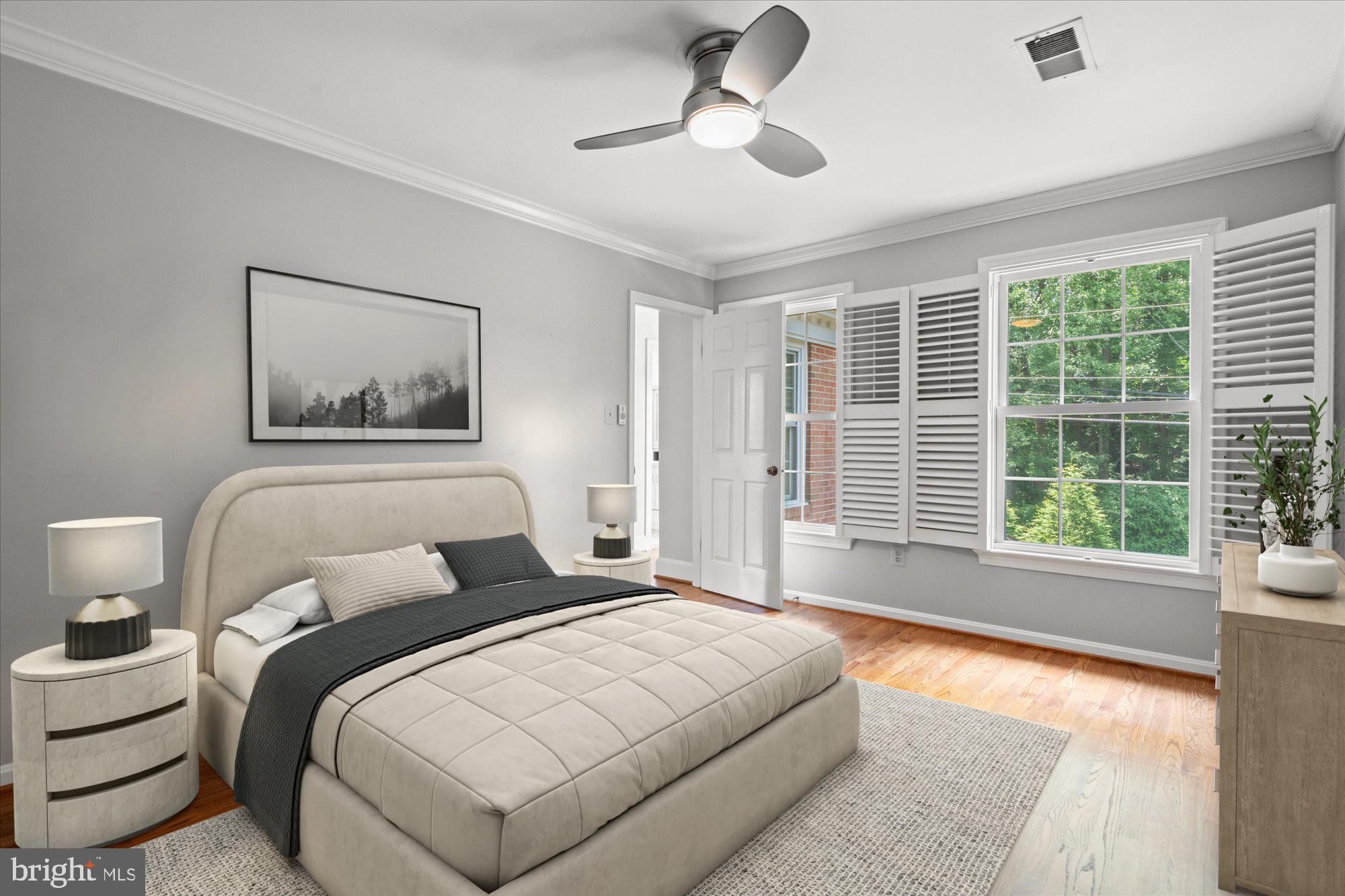 7287 Evans Mill Road McLean, VA 22101 - Photo 21 of 30 a bedroom with a large bed and a large window