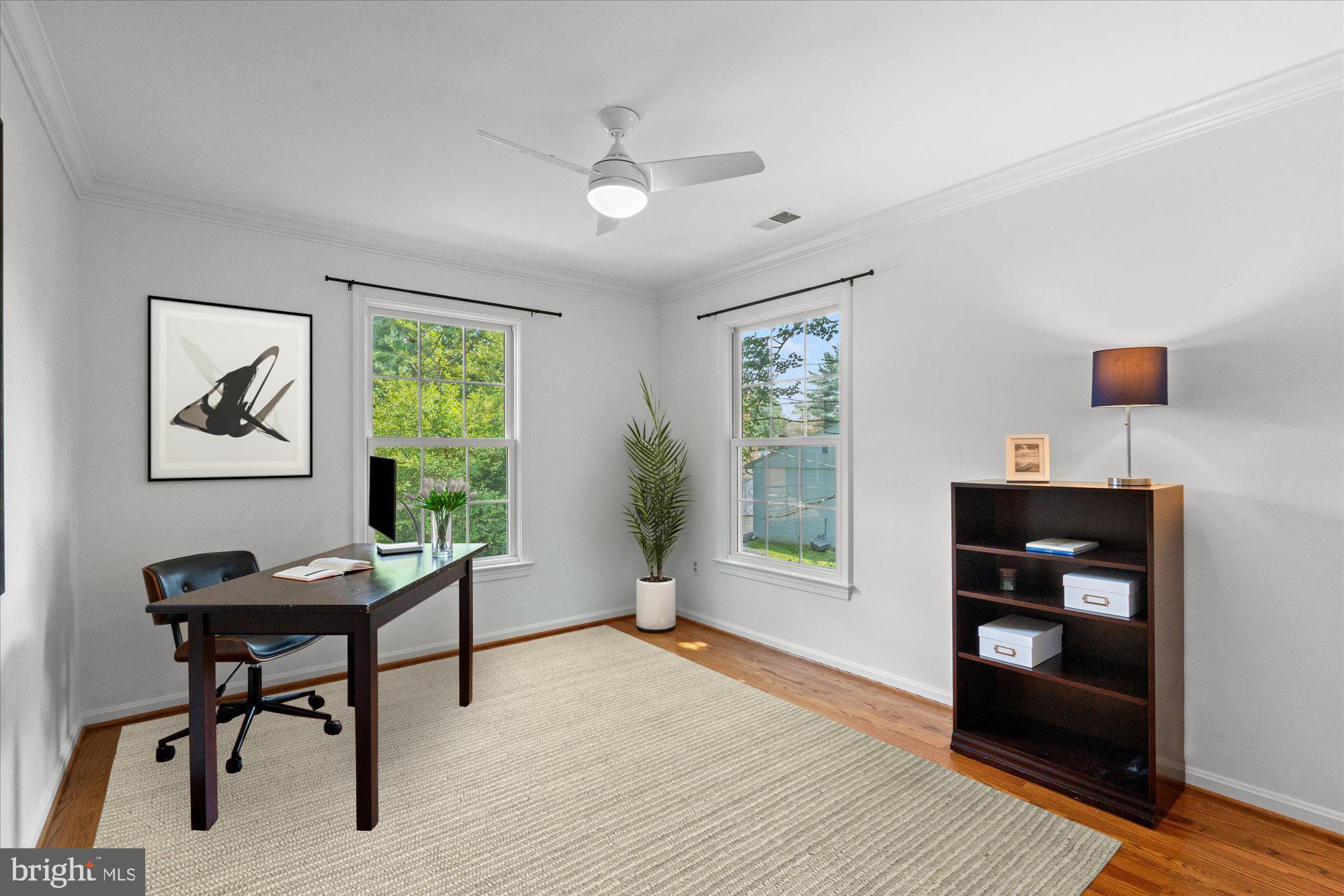 7287 Evans Mill Road McLean, VA 22101 - Photo 22 of 30 a view of a workspace with furniture and a window