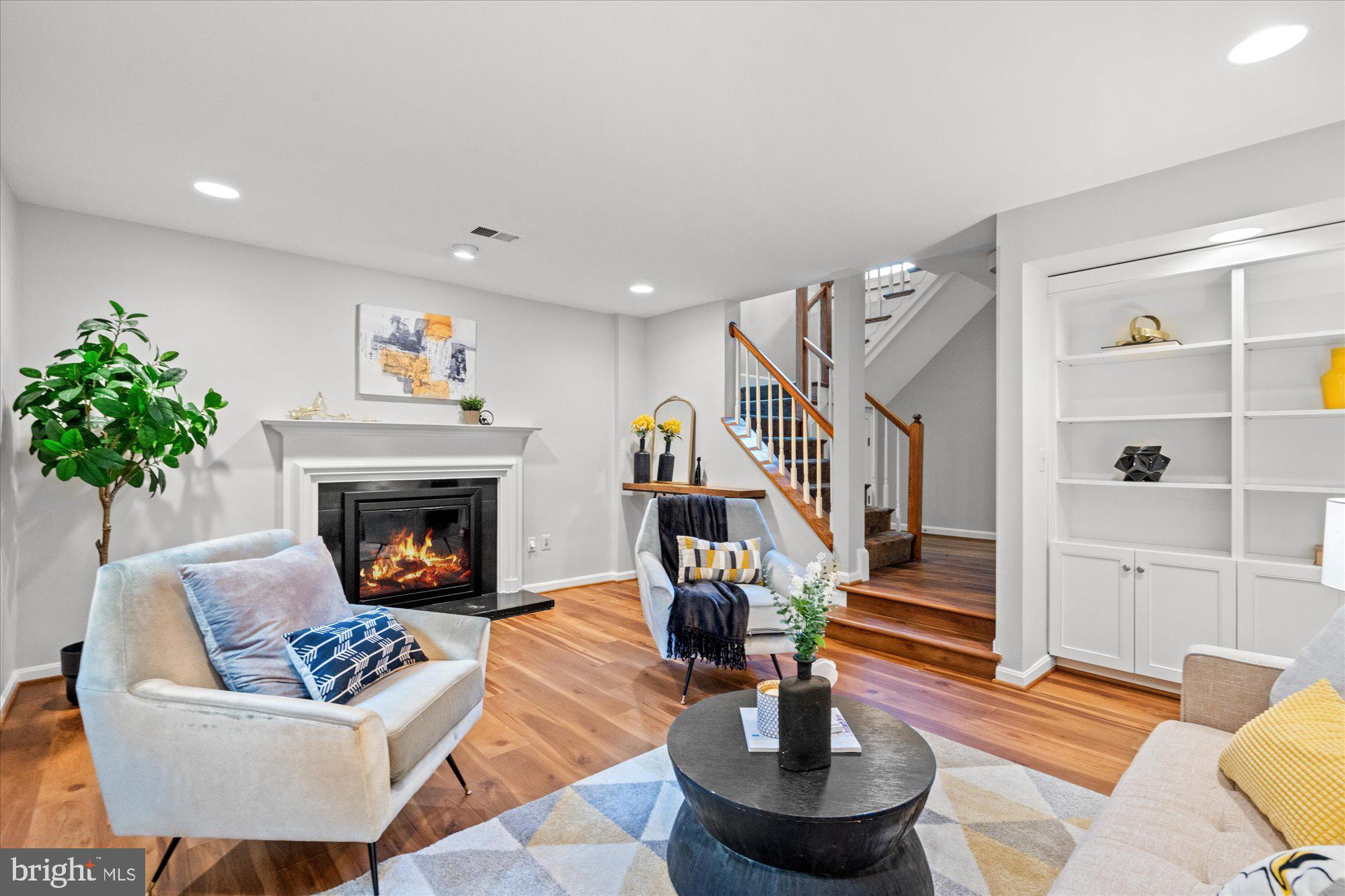 7287 Evans Mill Road McLean, VA 22101 - Photo 24 of 30 a living room with furniture and a fireplace