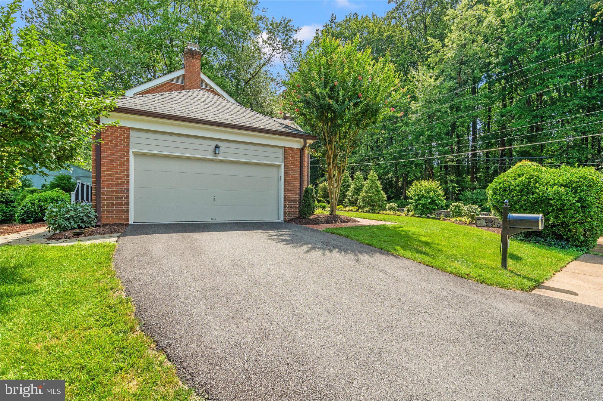 7287 Evans Mill Road McLean, VA 22101 - Photo 30 of 30 a front view of a house with garden