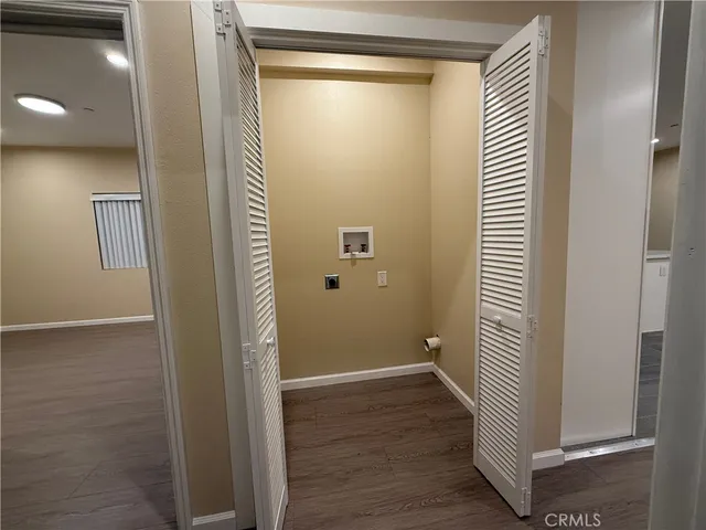 a view of a bathroom with wooden floor