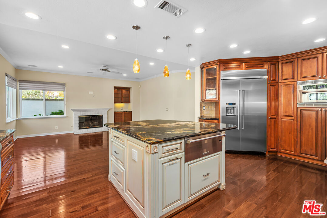 5 Daystar Irvine, CA 92612 - Photo 13 of 52 a kitchen with stainless steel appliances granite countertop a stove and a refrigerator