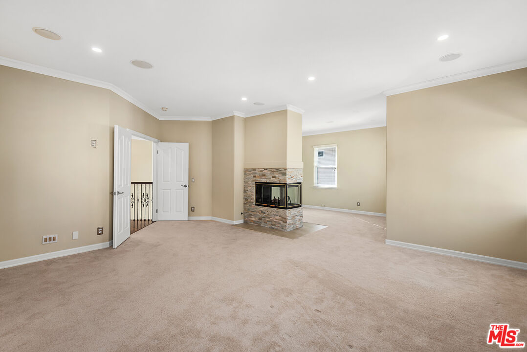 5 Daystar Irvine, CA 92612 - Photo 22 of 52 a view of empty room with a fireplace