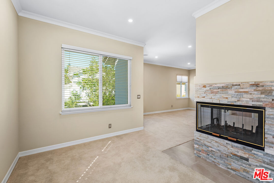 5 Daystar Irvine, CA 92612 - Photo 23 of 52 a view of an empty room with a fireplace and a window