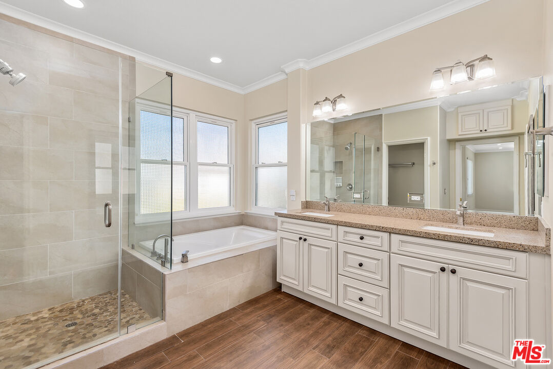 5 Daystar Irvine, CA 92612 - Photo 24 of 52 a spacious bathroom with a granite countertop tub sink shower and a mirror
