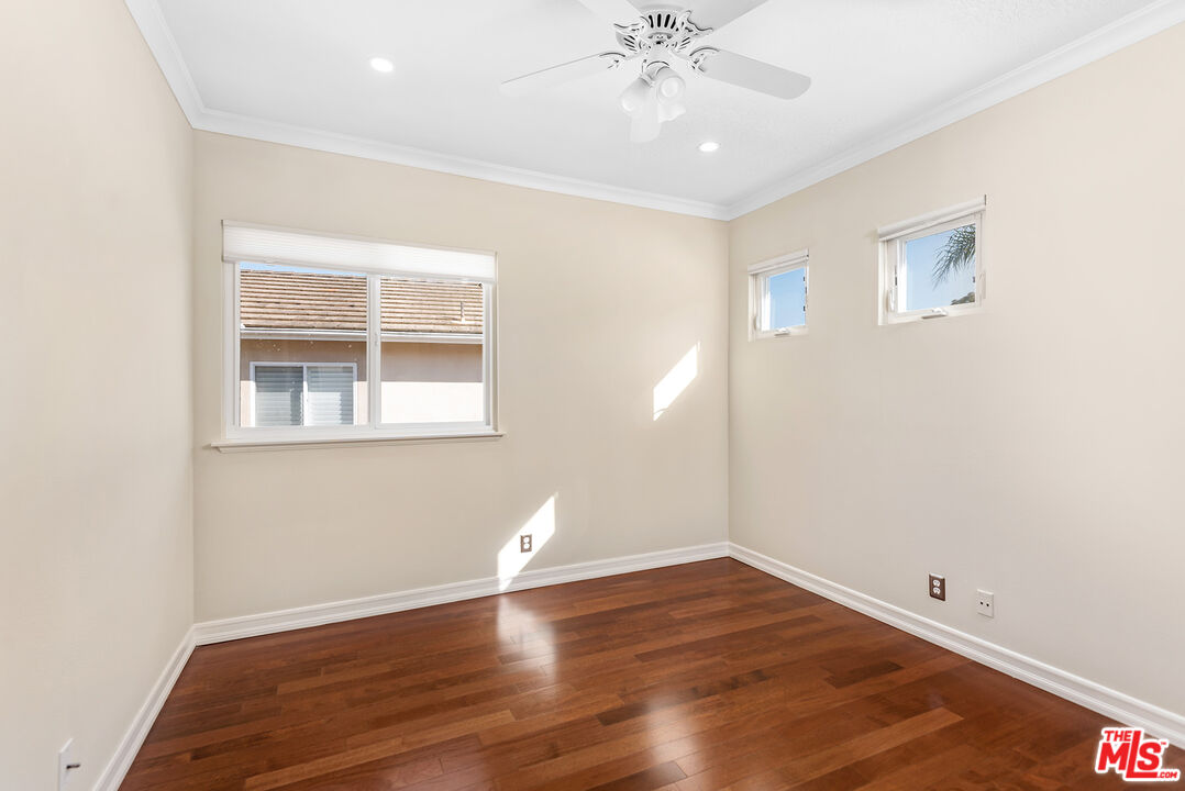 5 Daystar Irvine, CA 92612 - Photo 28 of 52 a view of an empty room with wooden floor and a window