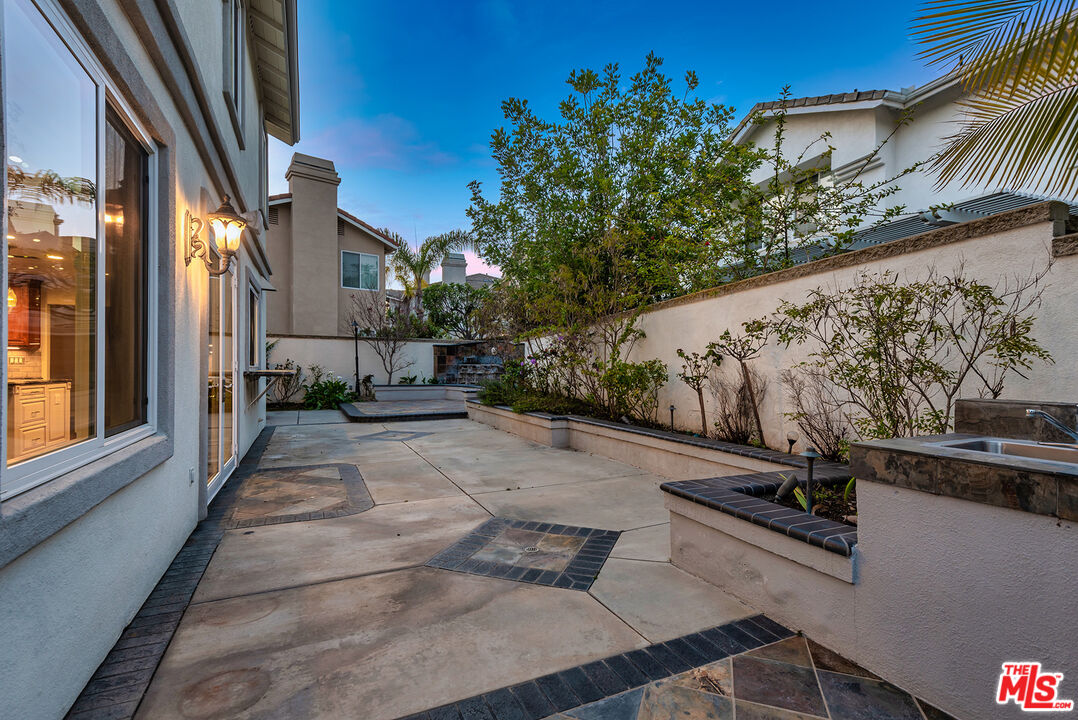 5 Daystar Irvine, CA 92612 - Photo 34 of 52 a view of a patio with table and chairs and potted plants