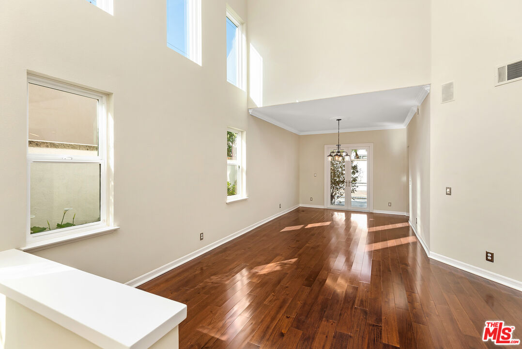 5 Daystar Irvine, CA 92612 - Photo 4 of 52 a view of an empty room with wooden floor and a window