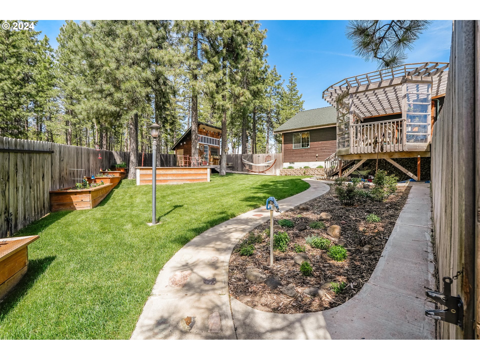 11 Deer Ridge Road Goldendale, WA 98620 - Photo 23 of 45 a view of a backyard with a garden