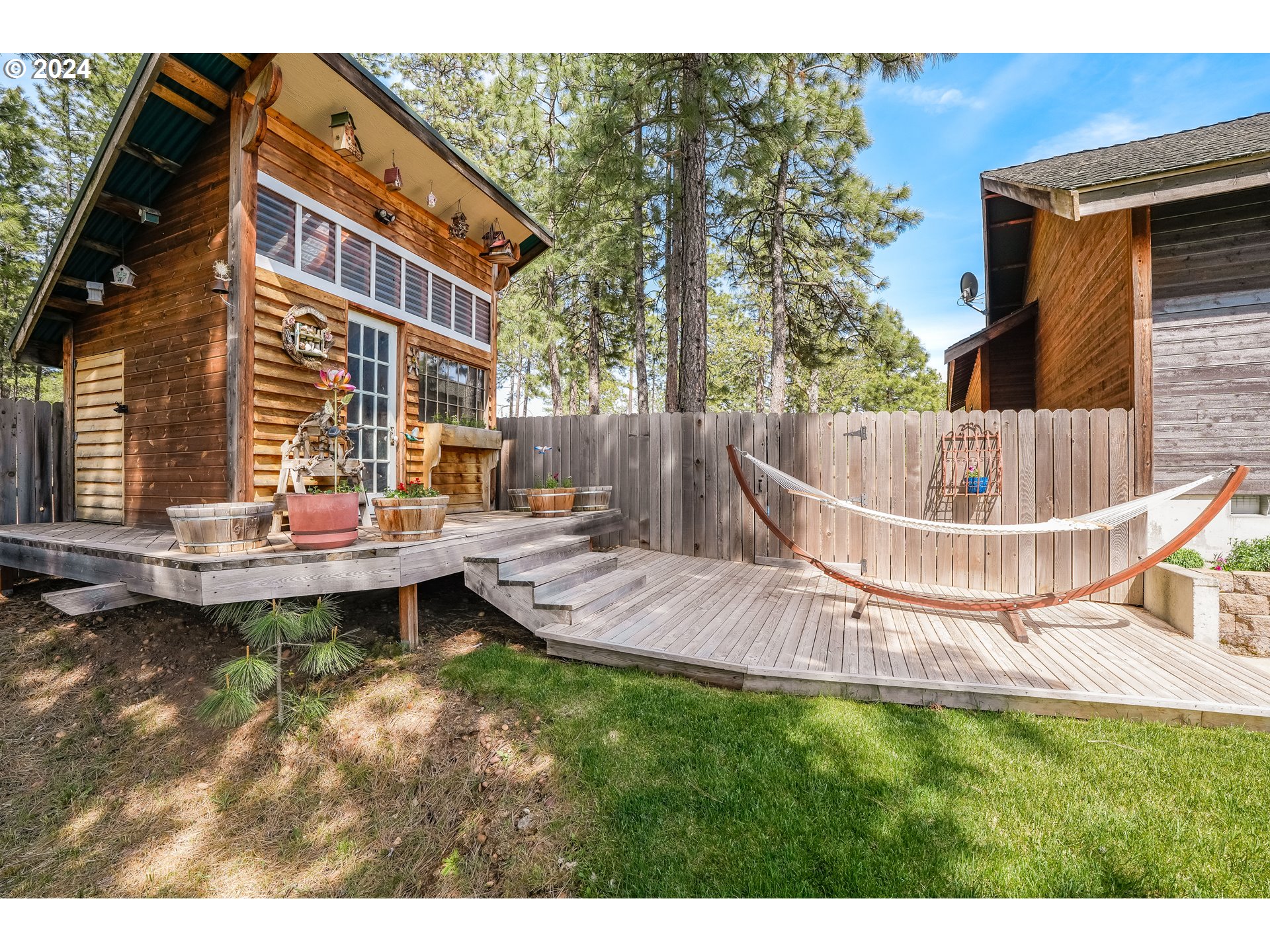 11 Deer Ridge Road Goldendale, WA 98620 - Photo 24 of 45 a view of a house with a swimming pool and sitting area
