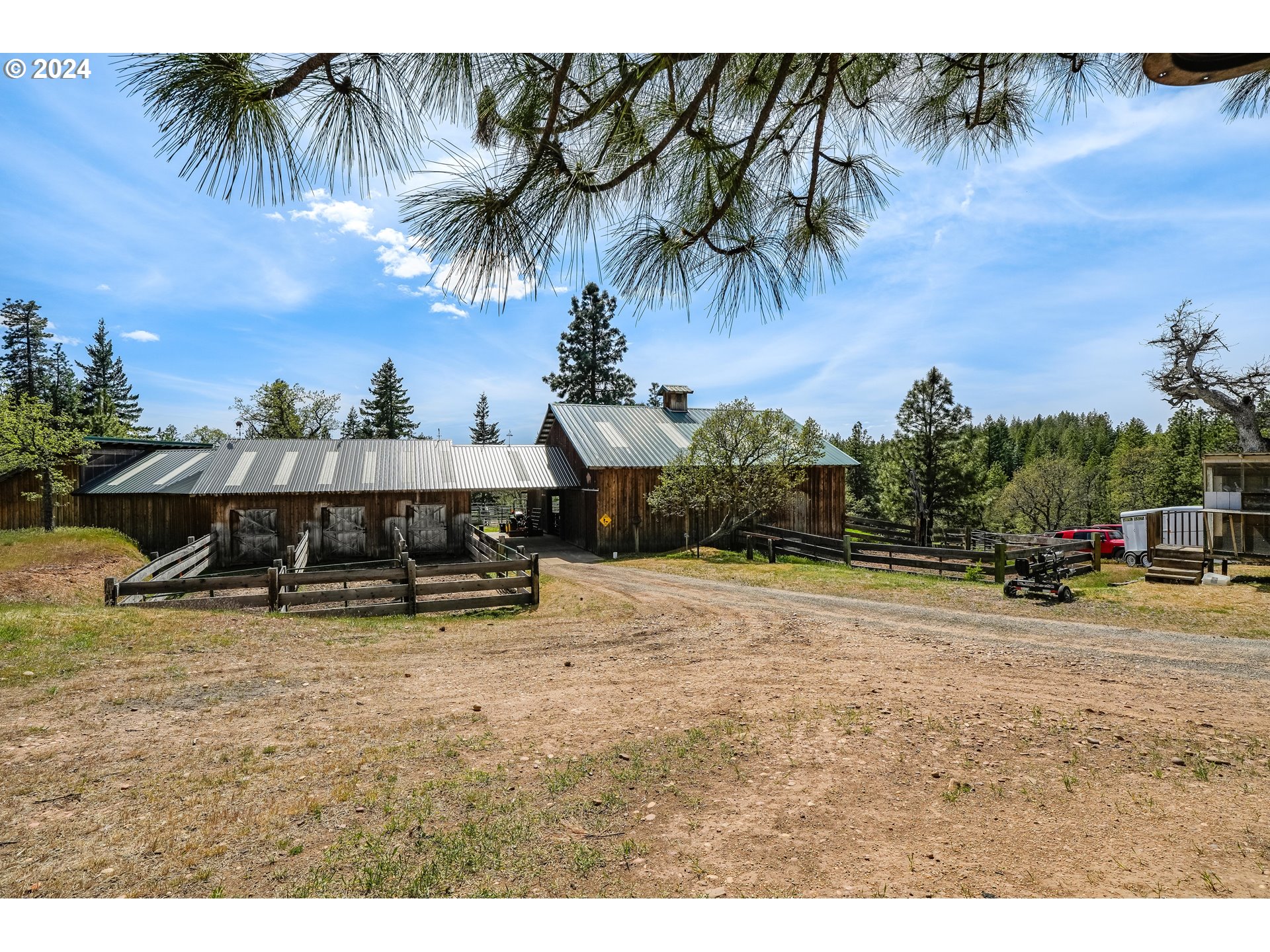 11 Deer Ridge Road Goldendale, WA 98620 - Photo 25 of 45 a view of a swimming pool and trees in front of house