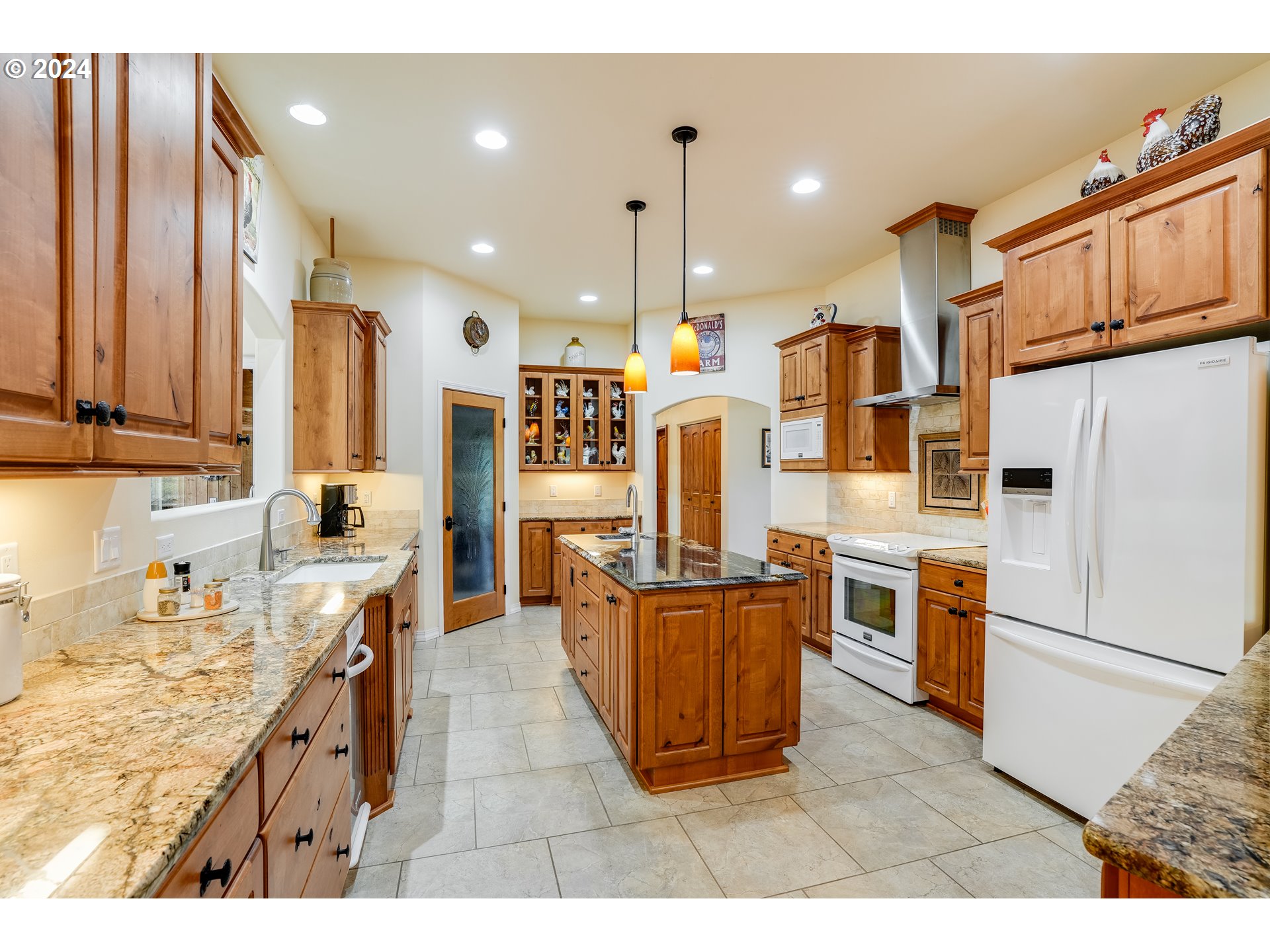 11 Deer Ridge Road Goldendale, WA 98620 - Photo 4 of 45 a kitchen with stainless steel appliances kitchen island granite countertop a refrigerator oven stove a sink and dishwasher