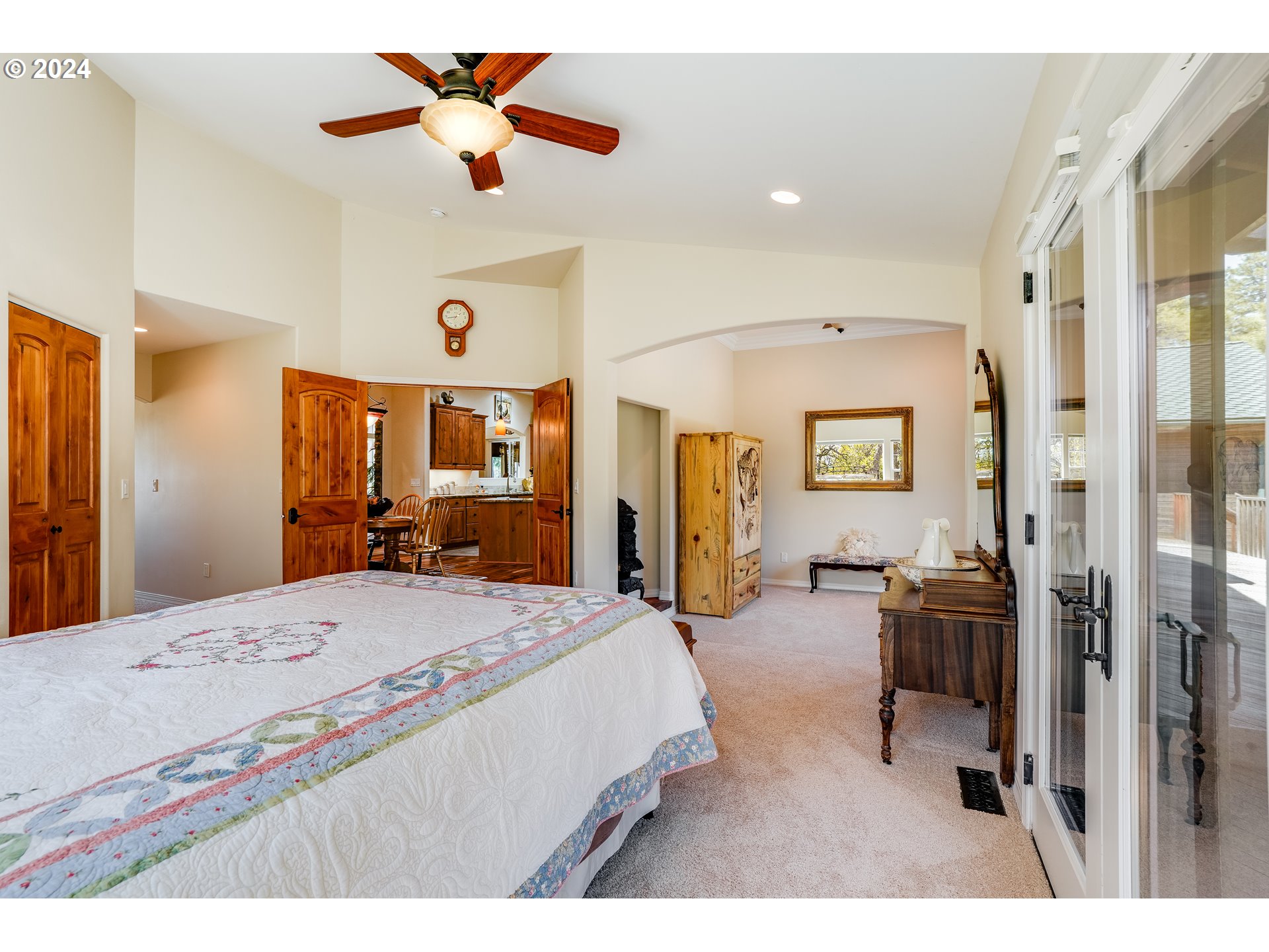 11 Deer Ridge Road Goldendale, WA 98620 - Photo 8 of 45 a bedroom with a bed and a chandelier