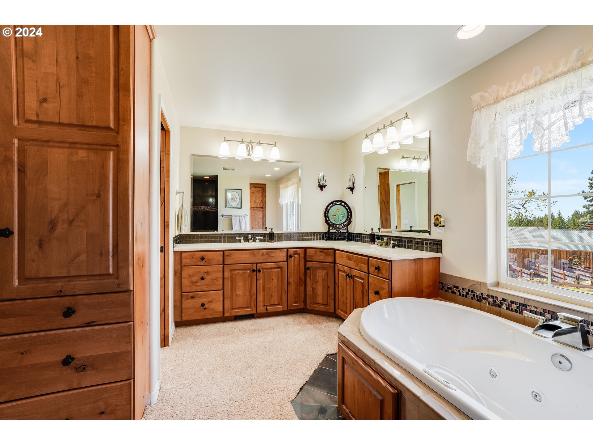 11 Deer Ridge Road Goldendale, WA 98620 - Photo 10 of 45 a bathroom with a sink double vanity granite tub shower and a mirror