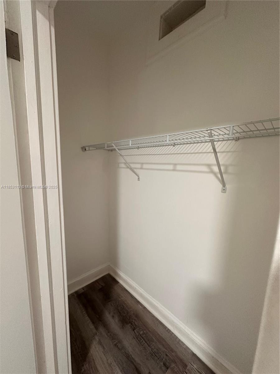 1630 Southwest 10th Street, Unit 8 Miami, FL 33135 - Photo 12 of 14 a view of a room with racks on the wall