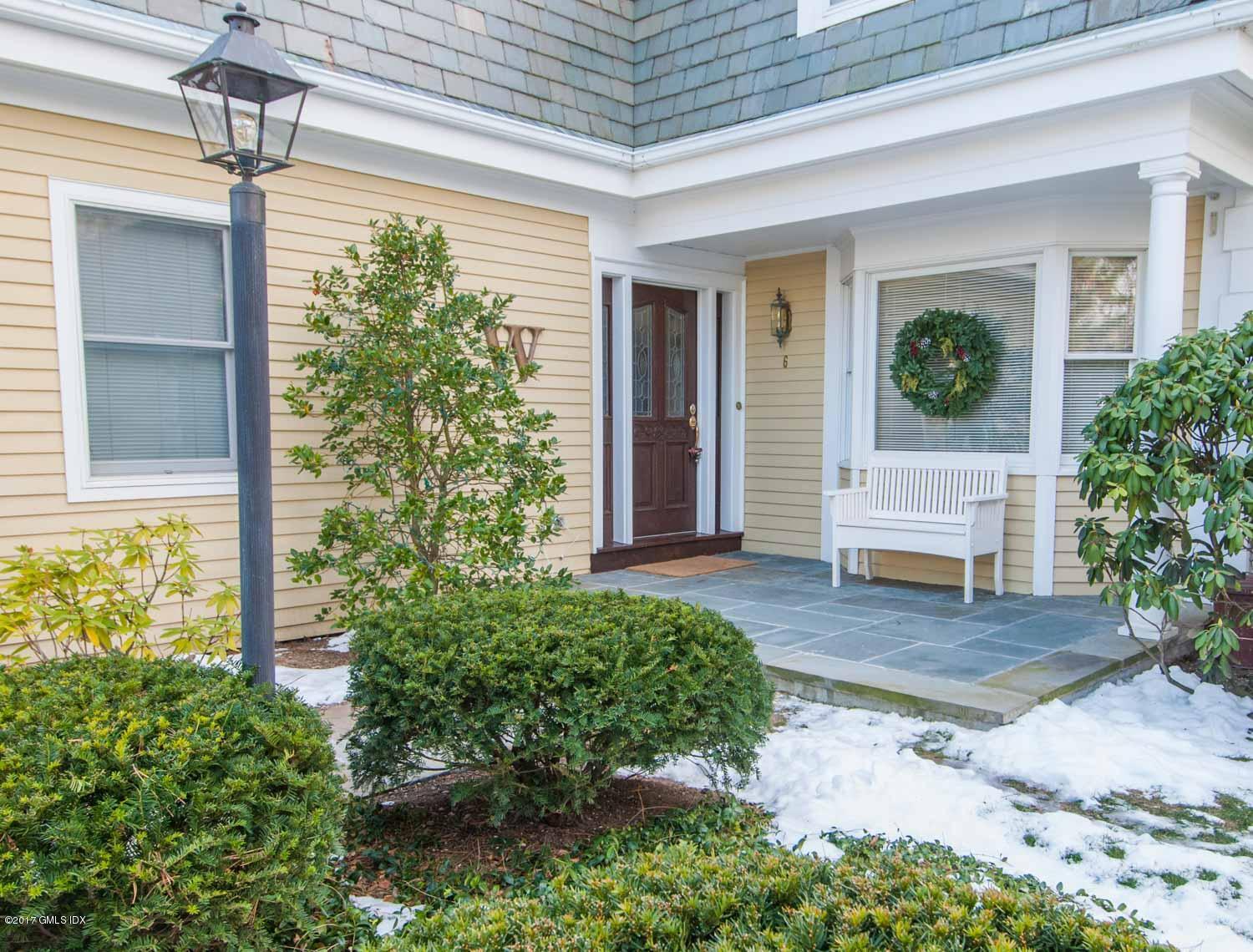 4 Old Church Road, Unit 6 Greenwich, CT 06830 - Photo 1 of 19 a front view of a house with garden