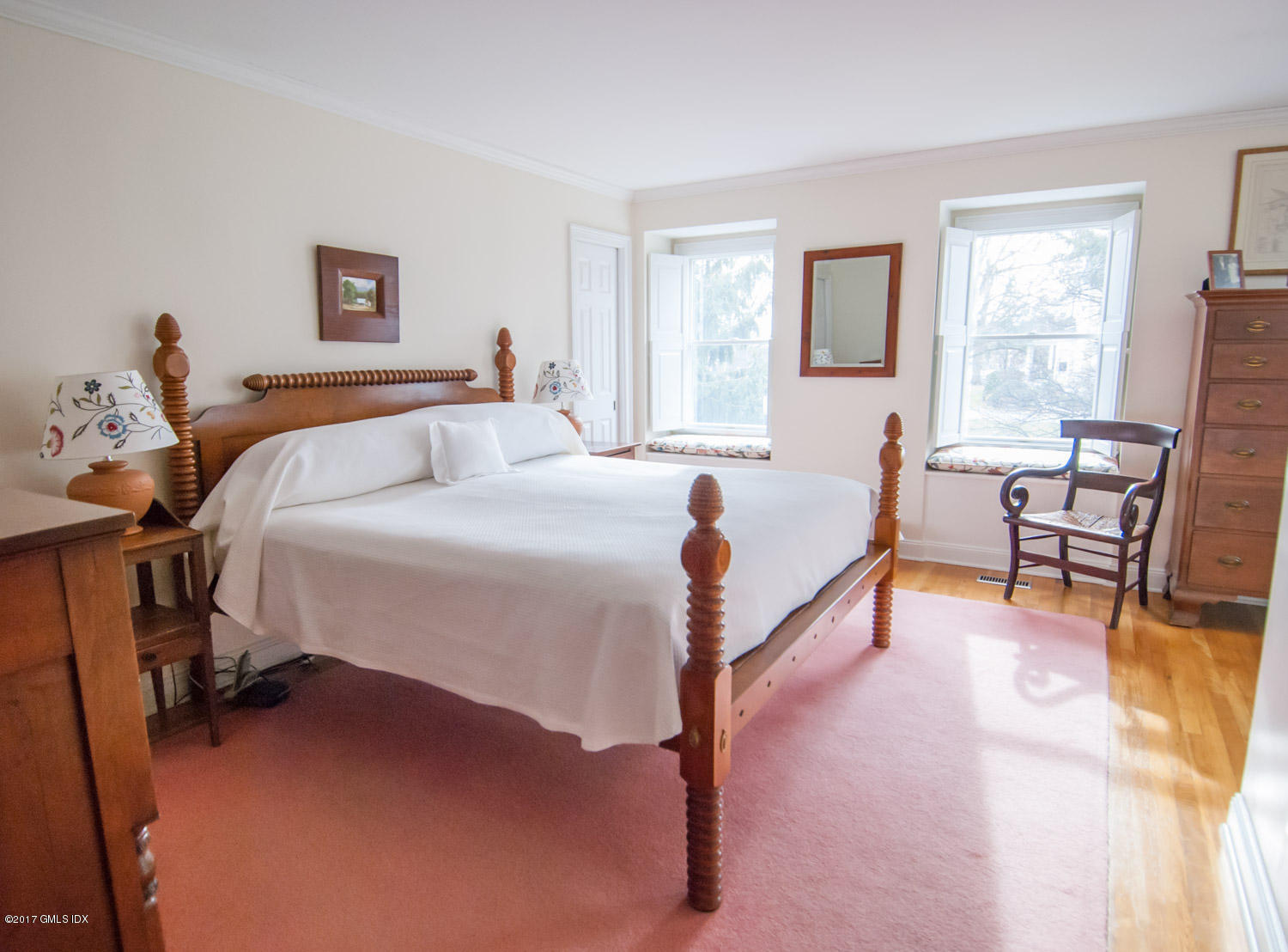 4 Old Church Road, Unit 6 Greenwich, CT 06830 - Photo 11 of 19 a bed room with a bed and a chair