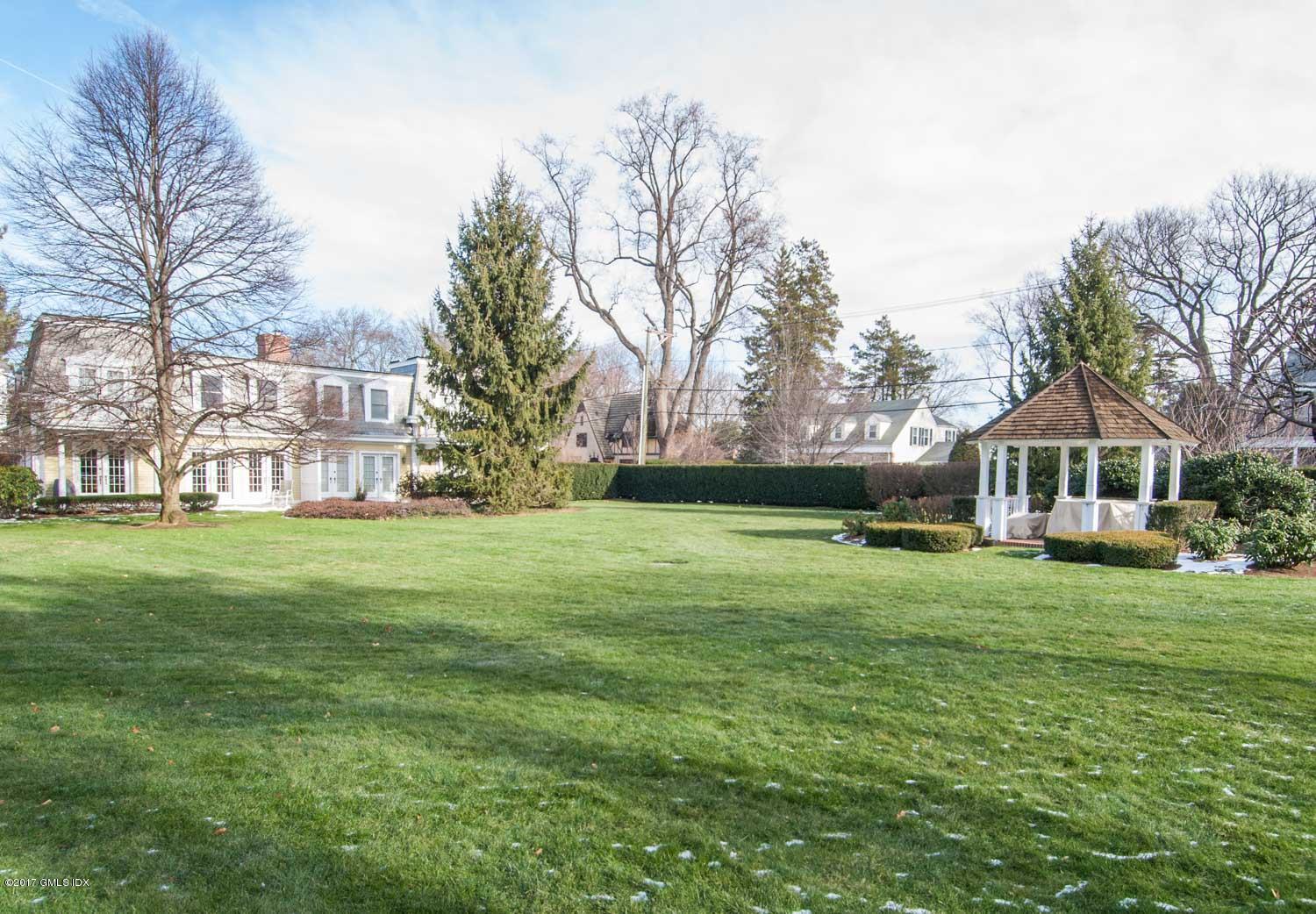4 Old Church Road, Unit 6 Greenwich, CT 06830 - Photo 18 of 19 a front view of a house with garden