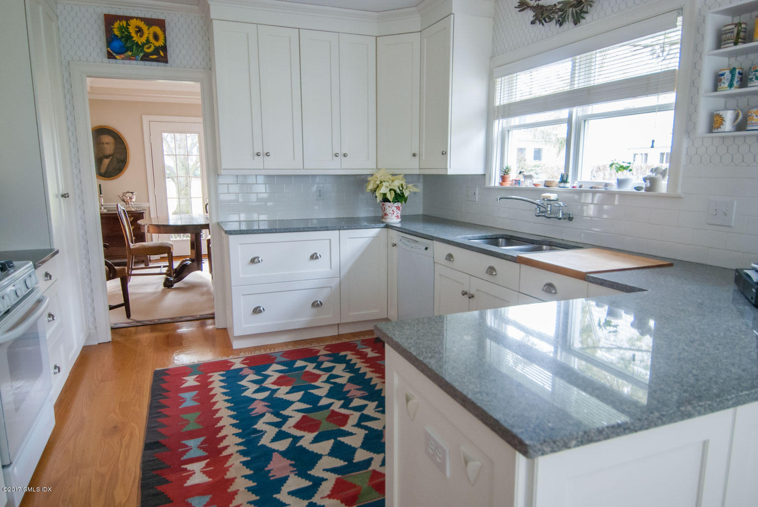 4 Old Church Road, Unit 6 Greenwich, CT 06830 - Photo 8 of 19 a kitchen with stainless steel appliances granite countertop a sink stove and cabinets