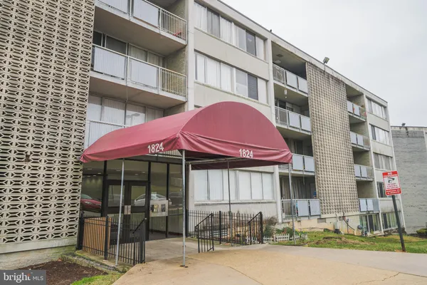 a view of a brick building with many windows