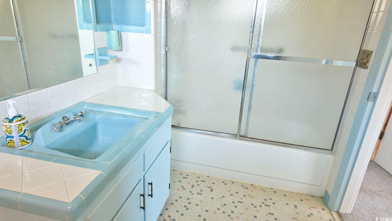 5408 Main Street Loris, SC 29569 - Photo 20 of 20 Bathroom featuring vanity and combined bath / shower with glass door