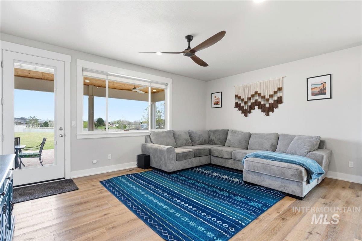 1282 Cimarron Court Middleton, ID 83644 - Photo 11 of 44 Living room featuring a ceiling fan and light wood-type flooring
