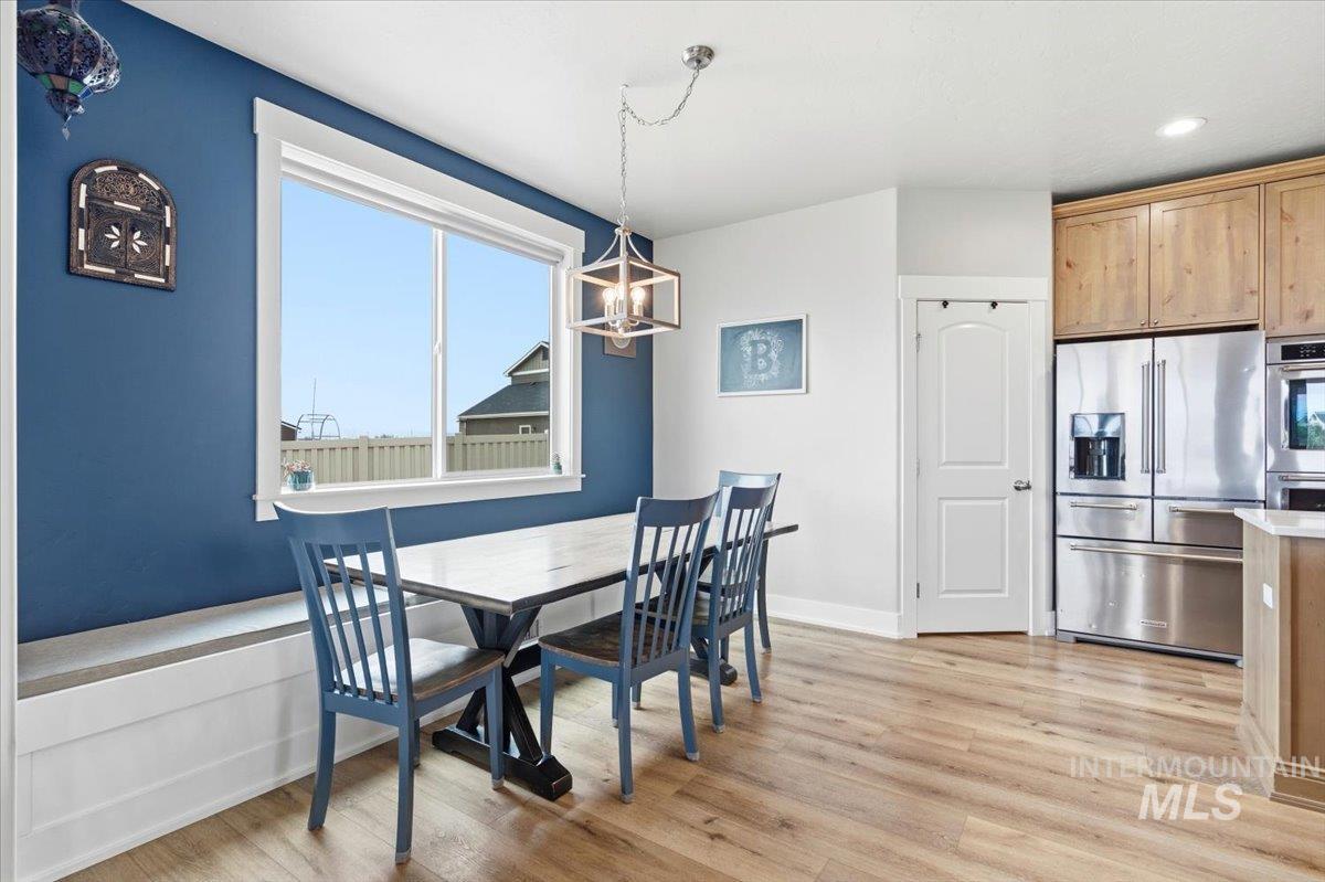 1282 Cimarron Court Middleton, ID 83644 - Photo 12 of 44 Dining area featuring light wood-style floors and hanging lights