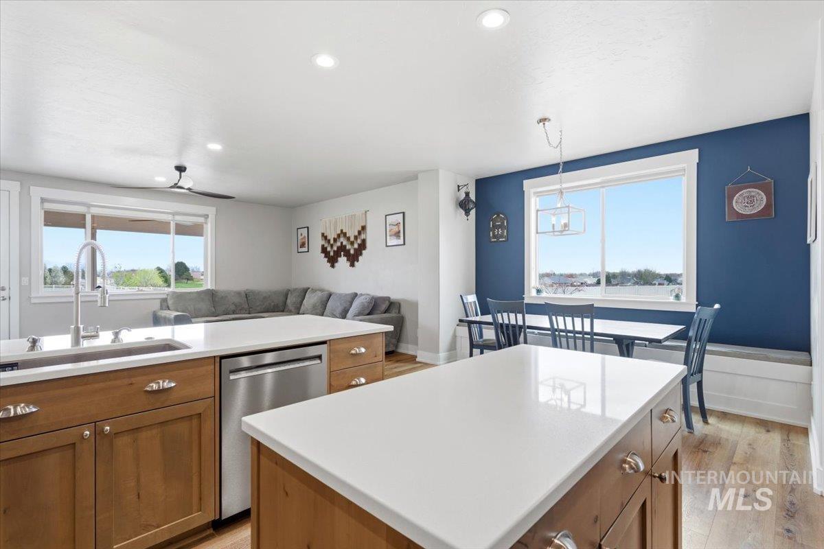 1282 Cimarron Court Middleton, ID 83644 - Photo 14 of 44 Kitchen featuring wood finish cabinetry, light wood finished floors, a center island, and dishwasher