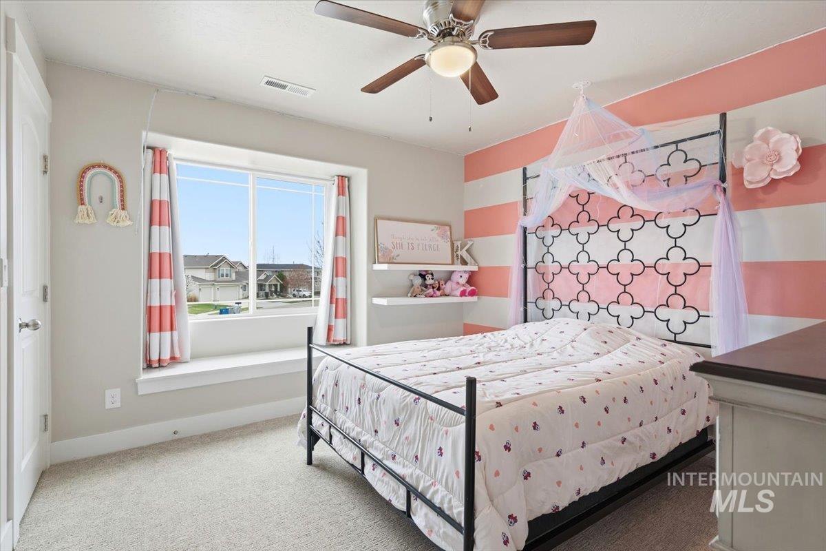 1282 Cimarron Court Middleton, ID 83644 - Photo 18 of 44 Bedroom featuring carpet and a ceiling fan