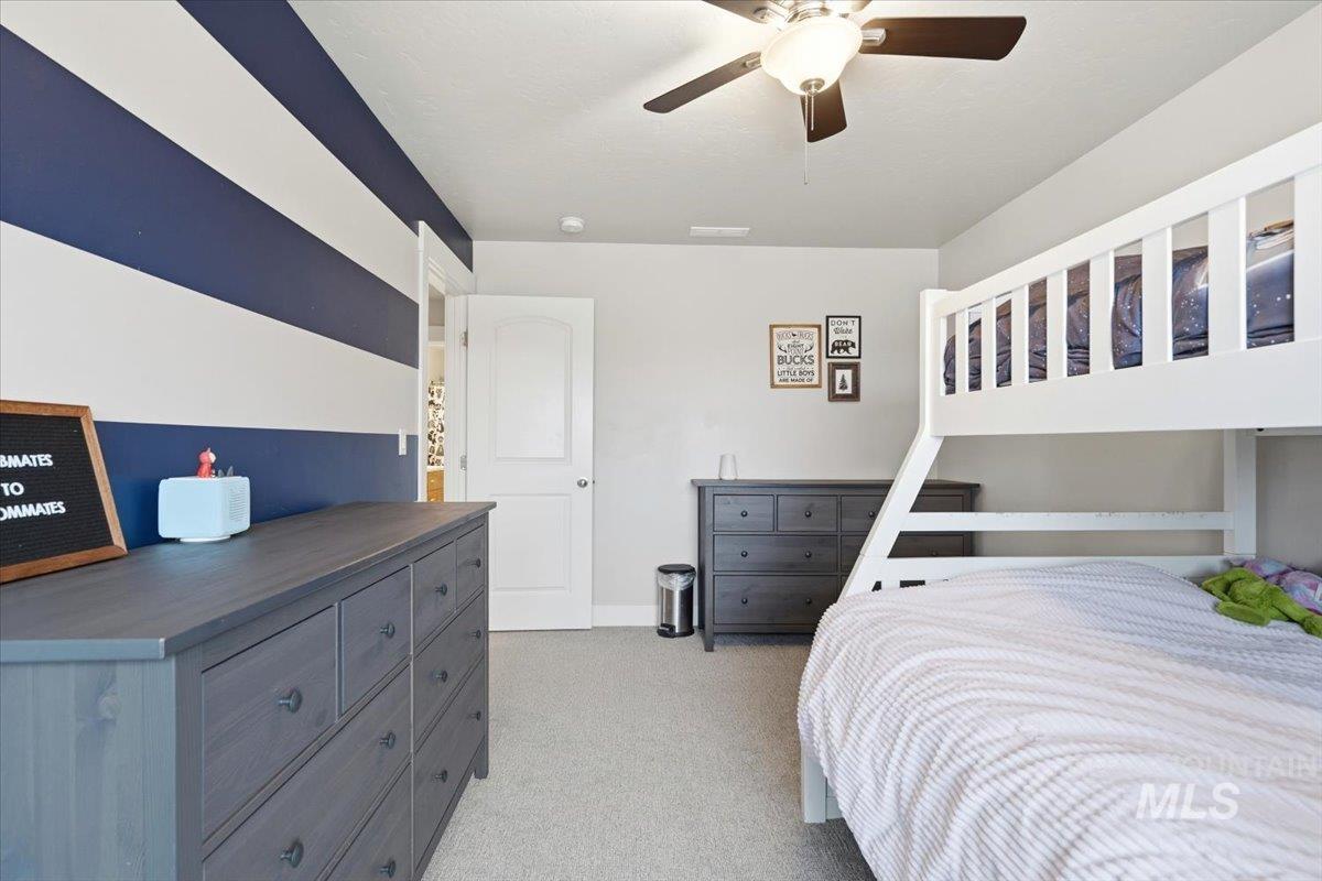 1282 Cimarron Court Middleton, ID 83644 - Photo 19 of 44 Bedroom with light colored carpet and ceiling fan