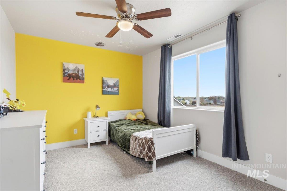 1282 Cimarron Court Middleton, ID 83644 - Photo 20 of 44 Bedroom featuring light colored carpet and ceiling fan