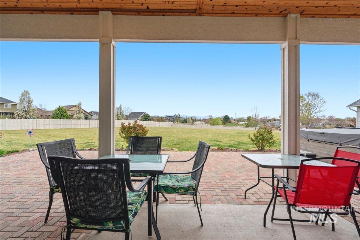 1282 Cimarron Court Middleton, ID 83644 - Photo 30 of 44 Fenced backyard featuring outdoor dining space and a patio