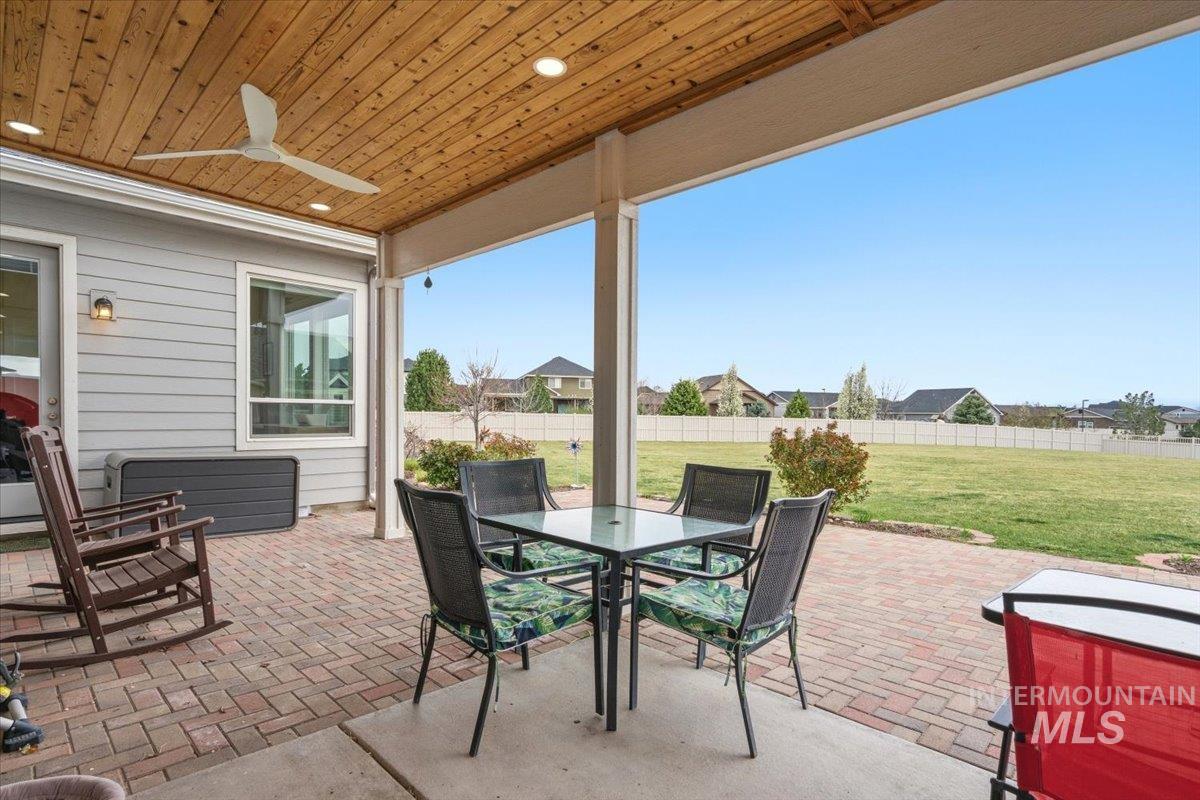 1282 Cimarron Court Middleton, ID 83644 - Photo 31 of 44 Fenced backyard with a patio, ceiling fan, and outdoor dining space