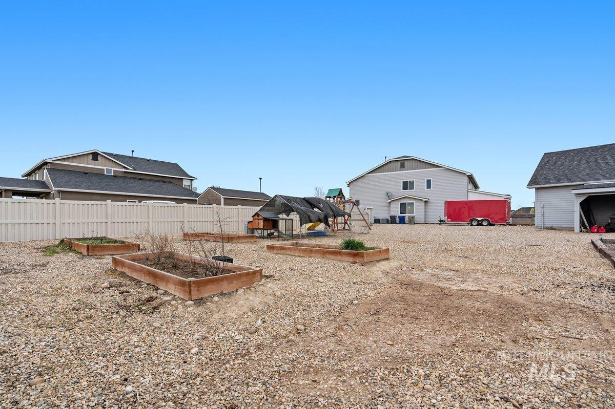 1282 Cimarron Court Middleton, ID 83644 - Photo 41 of 44 View of yard with a garden