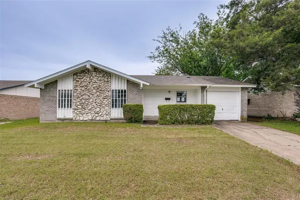 front view of a house with yard