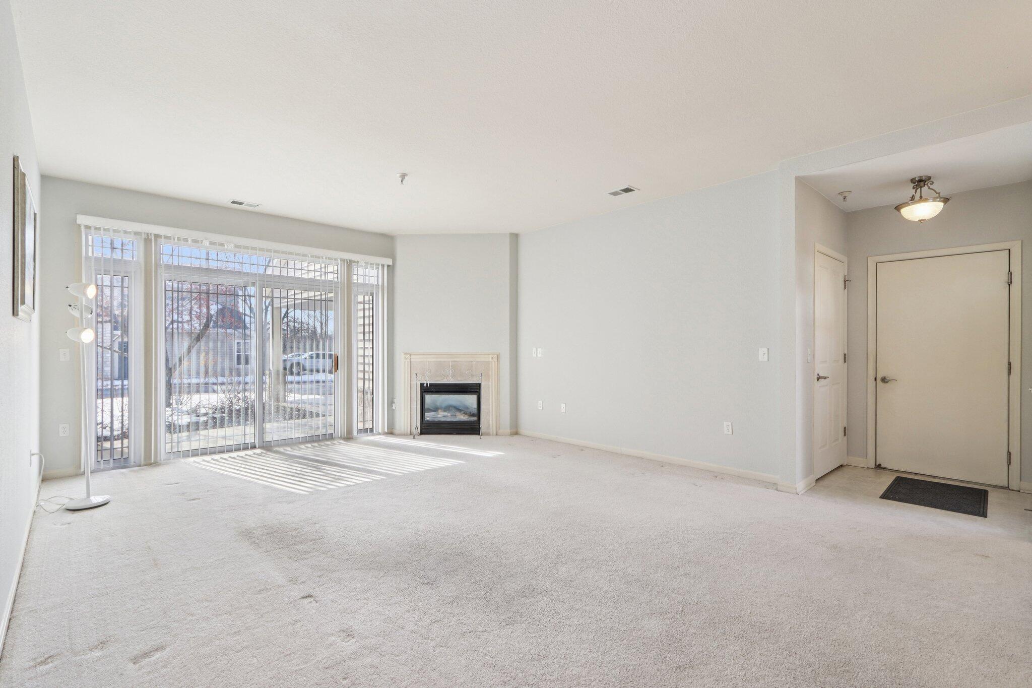 9405 South Cobblestone Way, Unit A Franklin, WI 53132 - Photo 7 of 15 Turn the fireplace on to set the mood and warm up on chilly nights.