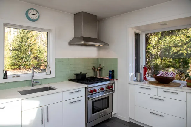 a kitchen with a stove and a sink