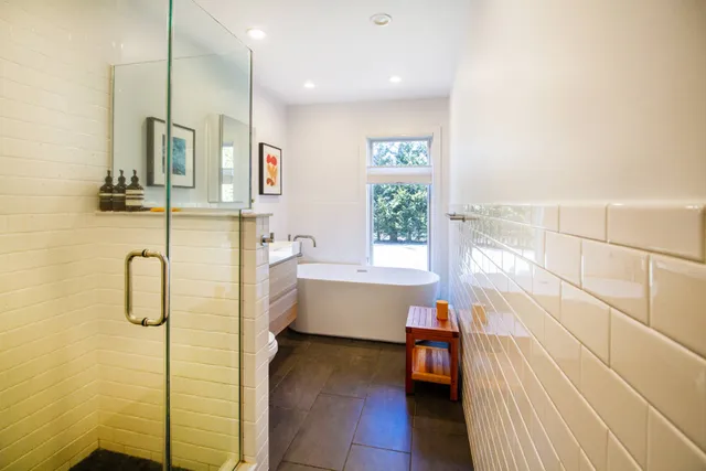 a bathroom with a bathtub and a shower