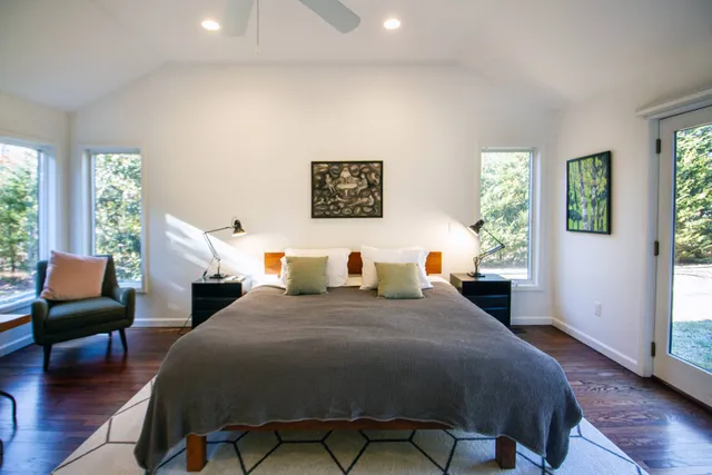 a bedroom with a bed and a couch