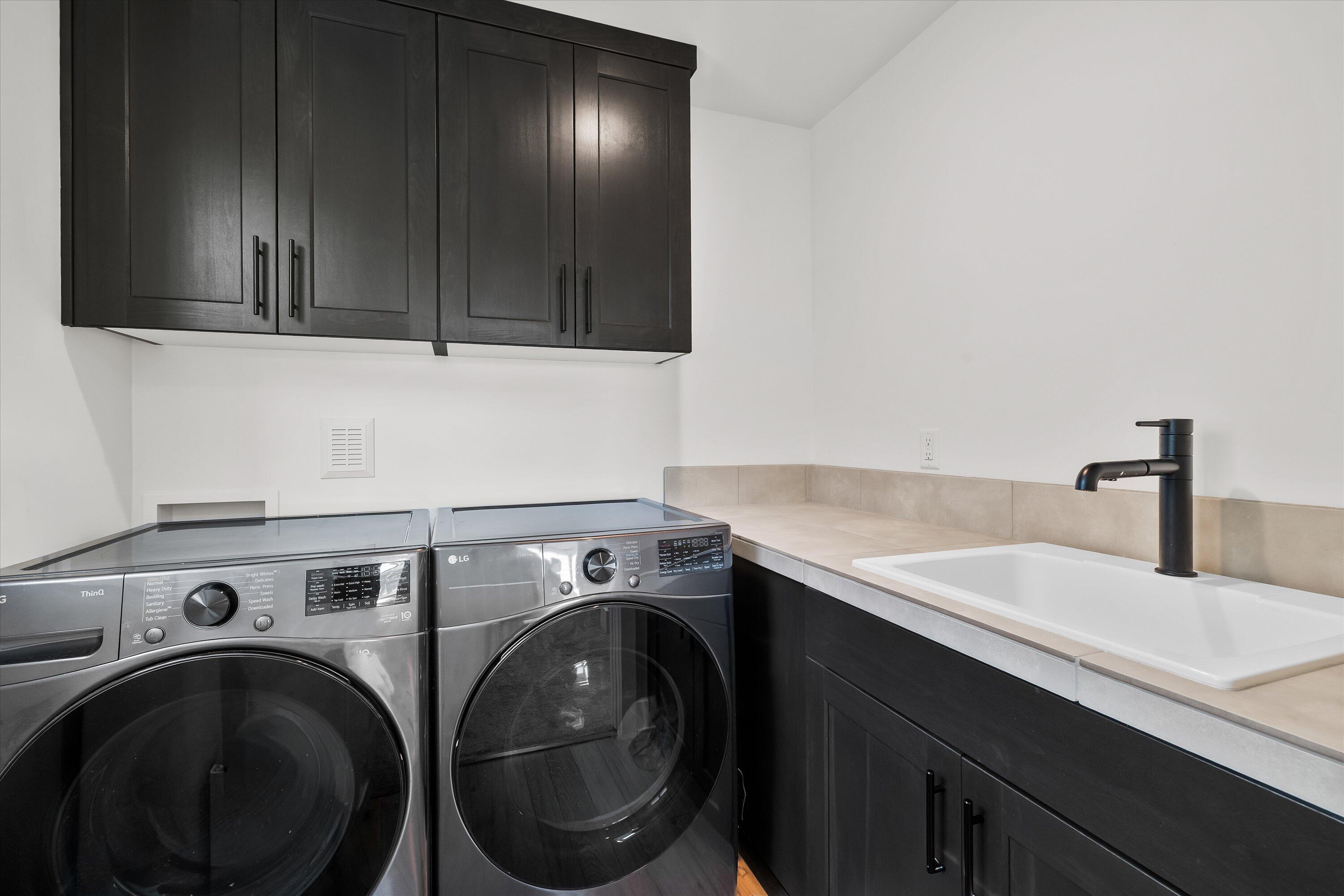 60903 Southeast Epic Place Bend, OR 97702 - Photo 28 of 48 a utility room with sink dryer and washer