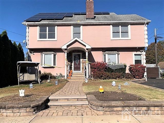 730 Center Street Dunellen, NJ 08812 - Photo 2 of 27 a front view of a house with entertaining space