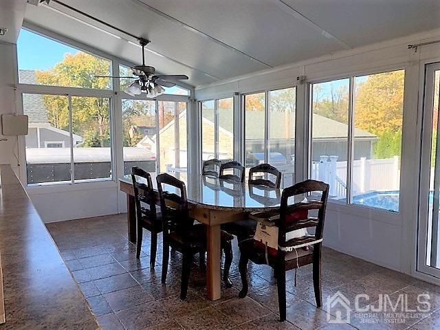 730 Center Street Dunellen, NJ 08812 - Photo 13 of 27 a view of a dining room with furniture large windows and wooden floor