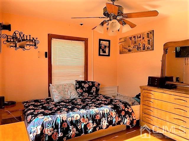730 Center Street Dunellen, NJ 08812 - Photo 19 of 27 a bed room with furniture and a window