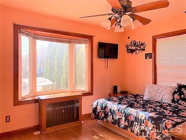 730 Center Street Dunellen, NJ 08812 - Photo 20 of 27 a bedroom with a bed and a window