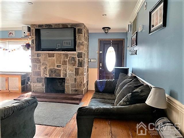 730 Center Street Dunellen, NJ 08812 - Photo 4 of 27 a living room with furniture fireplace and flat screen tv