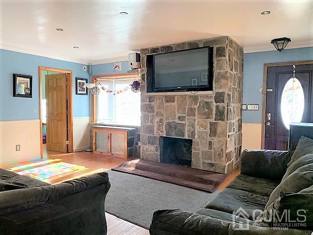 730 Center Street Dunellen, NJ 08812 - Photo 5 of 27 a living room with furniture fireplace and flat screen tv