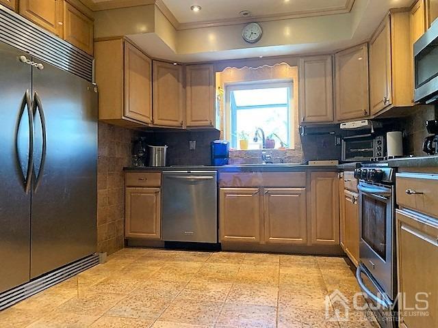 730 Center Street Dunellen, NJ 08812 - Photo 8 of 27 a kitchen with stainless steel appliances granite countertop a stove a sink and a refrigerator