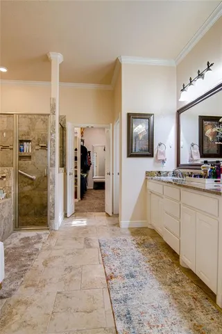 a view of a kitchen with a sink dishwasher a refrigerator and a flat screen tv